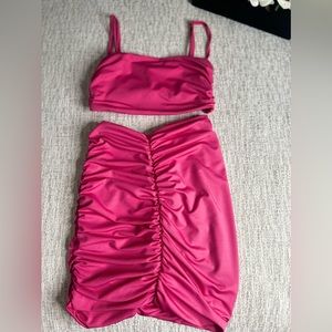 Hot pink- size s/m with adjustable straps for the top.
Mini skirt.